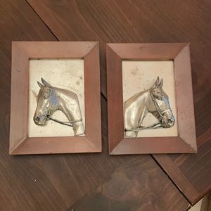 Set of two antique metal horse wall hangings